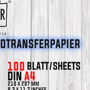 Puede incluir: Imagen de un producto con el texto "FOTOTRANSFERPAPIER" y "100 BLATT/SHEETS DIN A4 210 x 297 MM". El logotipo "SR TRANSFER" está en la esquina superior izquierda. El fondo es de vetas de madera clara.