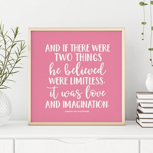May include: Pink framed print with a white quote that reads "And if there were two things he believed were limitless, it was love and imagination." The quote is attributed to "Cassandra Clare, Lady Midnight".