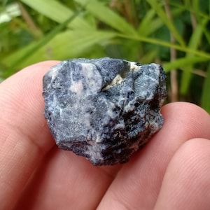 106.15 crt. Sapphire. Natural Rough Crystal. Unheat & Untreated (Geniune). Dark Blue Color. 28.15x23.25x18.9 mm. Approximately.