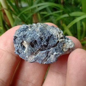 115.1 crt. Sapphire. Natural Rough Crystal. Unheat & Untreated (Geniune). Dark Blue Color. 37x26.7x17.9 mm. Approximately.