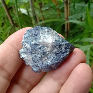 143.4 crt. Sapphire. Natural Rough Crystal. Unheat & Untreated (Geniune). Dark Blue Color. 32.65x31.05x17.3 mm. Approximately.