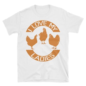 May include: White t-shirt with a brown circle graphic that says "I Love My Ladies" and features three chickens.