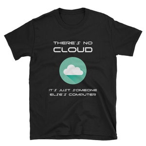 May include: Black t-shirt with white text that reads "THERE'S NO CLOUD IT'S JUST SOMEONE ELSE'S COMPUTER". A teal circle with a white cloud icon is in the centre of the shirt.