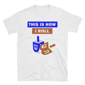 May include: White t-shirt with blue and brown text that reads "This is how I roll". A blue and white dreidel is pictured below the text.