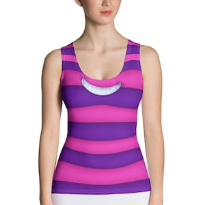 May include: A purple and pink striped tank top with a white Cheshire Cat grin on the front.