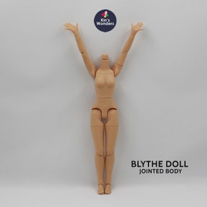 May include: A nude-colored Blythe doll body with jointed arms and legs. The doll is standing with its arms raised above its head. The text "BLYTHE DOLL JOINTED BODY" is printed below the doll.