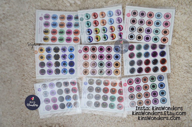 May include: Assortment of colorful doll eyes in various styles and colors. The eyes are packaged in clear plastic bags and labeled with the brand name "Kin's Wonders".