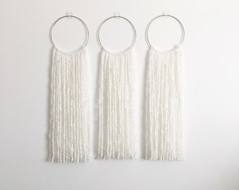 3 Anillo blanco colgante de pared
