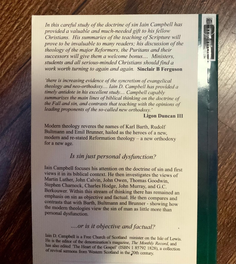 May include: A book cover with text discussing the doctrine of sin by Iain Campbell. The cover is primarily white with black text, including quotes and author names. The book's title and author are not visible.