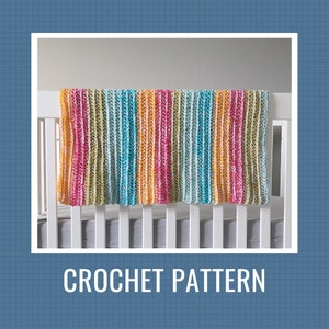 May include: A colorful striped crochet baby blanket draped over a white crib. The blanket is made with a variety of colors, including pink, yellow, blue, and green. CROCHET PATTERN is written in white text below the crib.