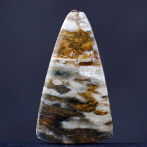 May include: A triangular shaped pendant made of brown, white, and black agate with a swirling pattern.