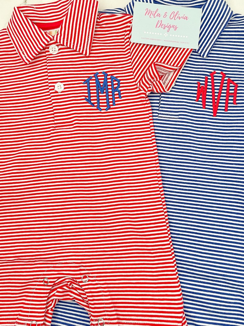 May include: Two short-sleeved polo rompers featuring thin horizontal stripes in red and white or blue and white. Each garment has a collar, two white buttons, and a monogrammed chest embroidery. A tag reads Mila & Olivia Designs.