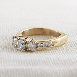Three Stone Diamond Engagement Ring in Yellow Gold