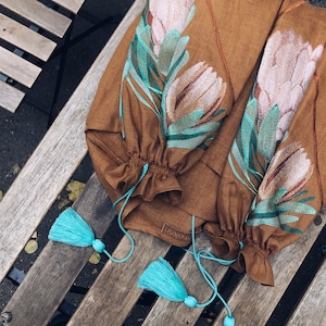 Women’s blouses luxurious bronze color a very unique design blouse with embroidered Protea Flower that stands out from the crowd