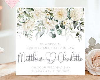 May include: A white card with a floral design at the top. The text reads "To a special brother and sister in law Matthew Charlotte On your wedding day Sunday 4th June 2023".