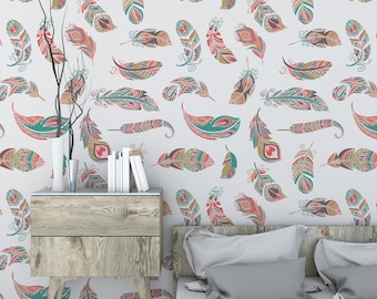 May include: A bedroom with a gray bedspread and two pillows. The wall behind the bed is covered in a white wallpaper with a pattern of colorful feathers. A wooden nightstand with two drawers is next to the bed.