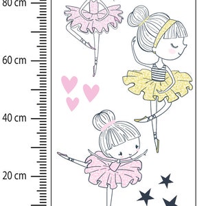 May include: Three cartoon ballerina girls with pink, yellow, and white tutus. The ballerinas are surrounded by pink hearts and gold stars.