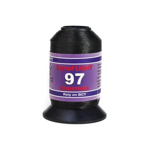 May include: A black DynaFLIGHT 97 bowstring spool. The spool has a purple and white label with the text "DynaFLIGHT 97 BOWSTRING Rely on BCY". The spool is on a black base.