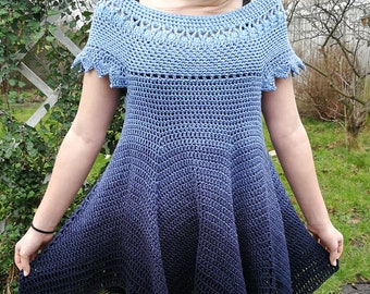 May include: A blue and black ombre crochet dress with a scalloped neckline and short sleeves.