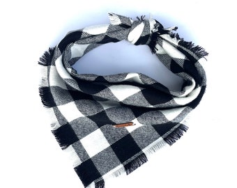 May include: Black and white buffalo plaid dog bandana with frayed edges.