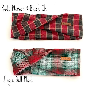 May include: Two plaid headbands. The top headband is red, maroon, and black. The bottom headband is green, red, and white. Both headbands have a small brown tag with text. The text "Red, Maroon & Black Ck" and "Jingle Bell Plaid" are written on the image.