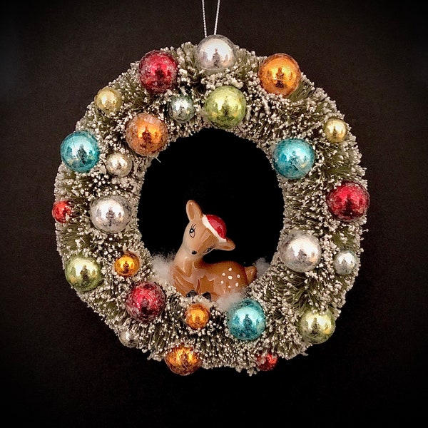 Vintage Inspired wreath with deer wearing Santa hat