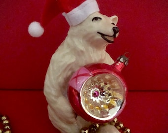 Vintage Polar Bear in Santa hat holding indent ornament
