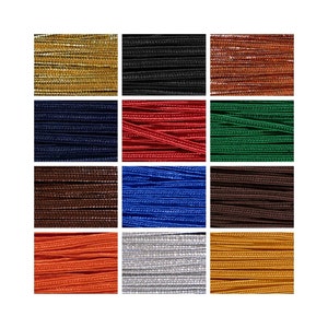 May include: A collection of twelve spools of colorful cord, each wound with a different color of thread. The colors include gold, black, brown, red, green, blue, silver, and orange.