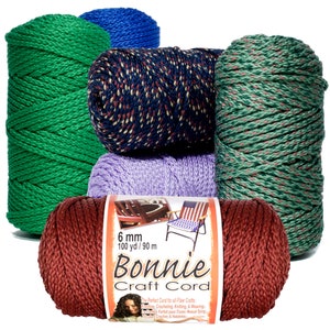 May include: Six spools of Bonnie Craft Cord in various colors, including green, blue, red, purple, and a multi-colored pattern. The spools are stacked on top of each other. The label on the front spool reads "6 mm 100 yd / 90 m Bonnie Craft Cord The Perfect Cord for all Fiber Crafts Knitting, Crocheting, Knitting, & Weaving Le Cordon Parfait pour Tisser, Noeud Tying Tricotint Crochet & Habiletes".