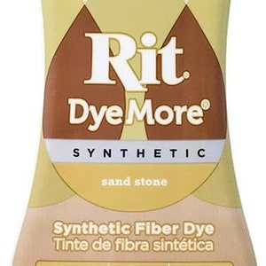 May include: A bottle of Rit Dye More Synthetic Fiber Dye in the color sand stone. The bottle is 7.0 fl oz (207 ml) and is labeled for use on polyester, nylon, and acrylic fabrics. The bottle has a white cap and a brown label with white text.