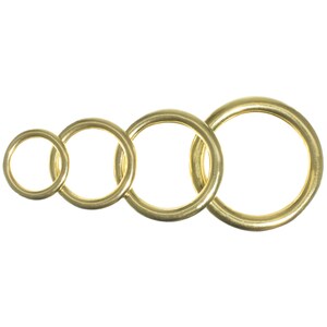 May include: Four gold-colored metal rings of different sizes, arranged in a row from smallest to largest.