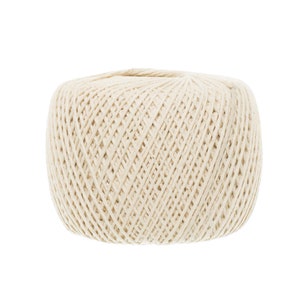 May include: A ball of natural white cotton twine. The twine is tightly wound and has a rough texture.