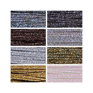 May include: Assortment of 10 spools of metallic thread in various colours, including silver, gold, brown, pink, and white. The thread is braided and has a shiny finish.