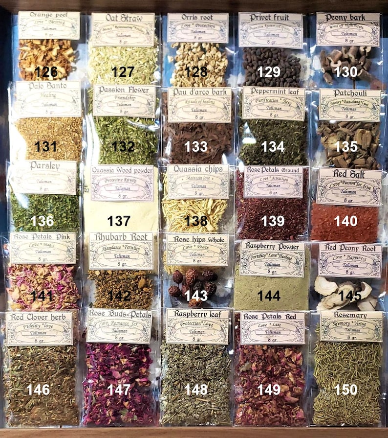 May include: A selection of dried herbs and botanicals, each packaged in a small, clear plastic bag. The bags are labelled with the herb's name, including "Orange Peel" and "Rosemary," and other text. The herbs display a variety of colours and textures, from orange peel to green leaves and red petals.