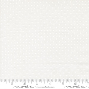 May include: Off-white fabric with a repeating pattern of small, evenly spaced white dots. The fabric is measured in inches along the bottom edge, with the brand name "moda" visible.