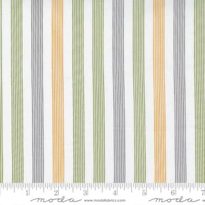 May include: White fabric with alternating stripes of green, orange, and gray. The fabric is marked with a ruler and the word "moda" appears twice.