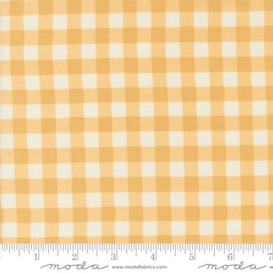 May include: Close-up of a fabric with a yellow and white gingham pattern. The fabric has a repeating square design, with alternating yellow and white squares. The fabric is likely cotton or a similar material, and is suitable for quilting or other craft projects.