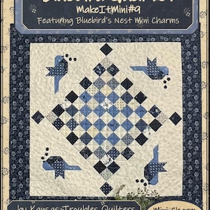 May include: A quilted fabric square with a blue and white diamond pattern, featuring four bluebird designs. The text "Bluebird Quartet" and "Make It Mini #9" are displayed at the top, with "Mini Charm Friendly" at the bottom.