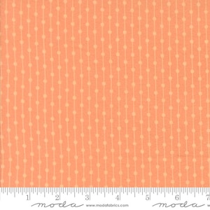 May include: Peach-colored fabric with a repeating pattern of vertical lines and small dots. The lines are a lighter shade of peach, creating a subtle contrast. The fabric is measured in inches.