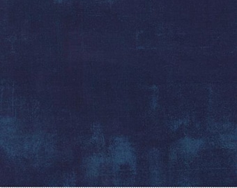 May include: A solid navy blue fabric with a subtle textured pattern. The fabric has a slightly distressed look, with faded areas and a hint of blue-green.