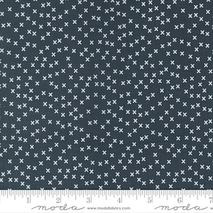 May include: A dark blue fabric with a white x pattern. The fabric is a repeating pattern of small white x's on a dark blue background.