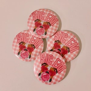 May include: Four round buttons with a pink and white gingham pattern. Each button features a bulldog wearing red heart-shaped sunglasses and blowing a pink bubble. The text "SIC EM" is printed on each button.