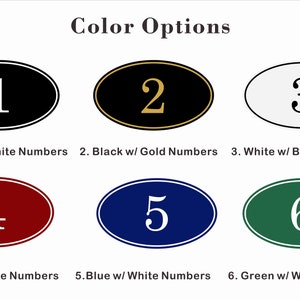 May include: Six oval-shaped signs with different color backgrounds and white or gold numbers. The signs are numbered 1 through 6. The colors are black, gold, white, red, blue, and green.