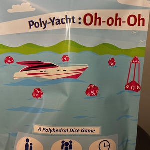 May include: A bag for a dice game called "Poly-Yacht: Oh-oh-Oh." The bag features a boat graphic on a blue water background with dice and a buoy. The text "A Polyhedral Dice Game" is also included. The game is for ages 14+ and 1+ players.