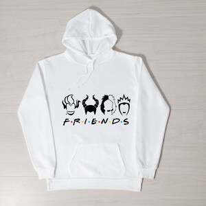 May include: White hooded sweatshirt with a black graphic of four Disney villain characters and the word "FRIENDS" in black with colorful dots.