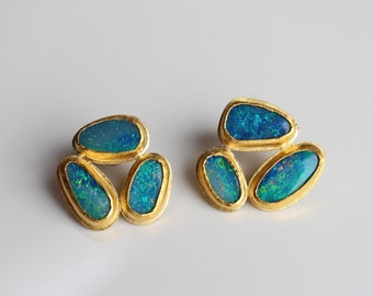 large fine gold stud earrings with blue-green opals, huge stud earrings made of 24k gold with turquoise opal, blue opal earrings made of unique gold