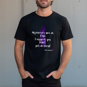May include: Black t-shirt with a purple flame graphic and the text "My nerves are on FIRE I suggest you DON'T get on them! - Fibre warrior"