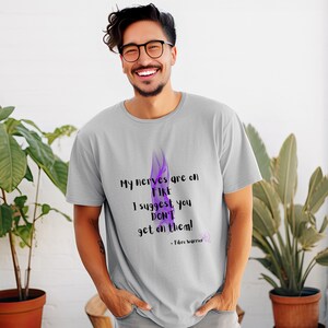 May include: A gray t-shirt with a purple flame graphic and the text "My nerves are on FIRE I suggest you DON'T get on them! - Fibro warrior".
