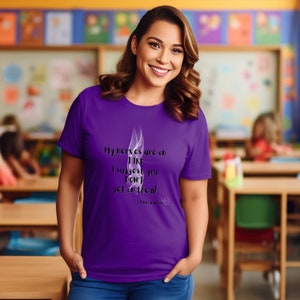 May include: Purple t-shirt with a white smoke design and the text "My nerves are on FIRE I suggest you DON'T get on them!"  - Fibre Warrior