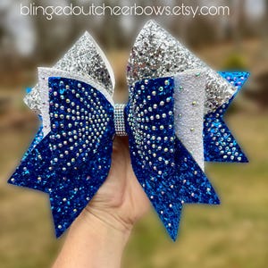 Team orders only!!  Min order 10+ bows//Large 8.5” bow with royal blue, white and silver cheer bow//  blue rhinestone cheer bow//